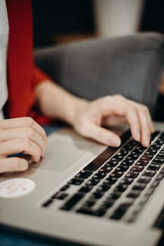 Person Using Gray Laptop Computer